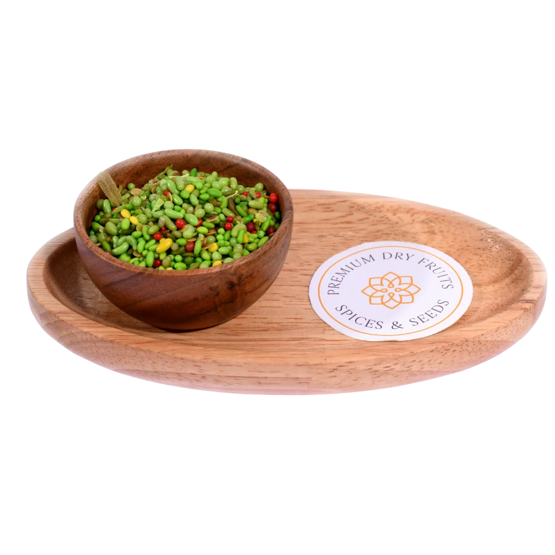 Green Mix Mouth Freshener in a wooden bowl highlights a vibrant mix of fennel seeds and herbs.