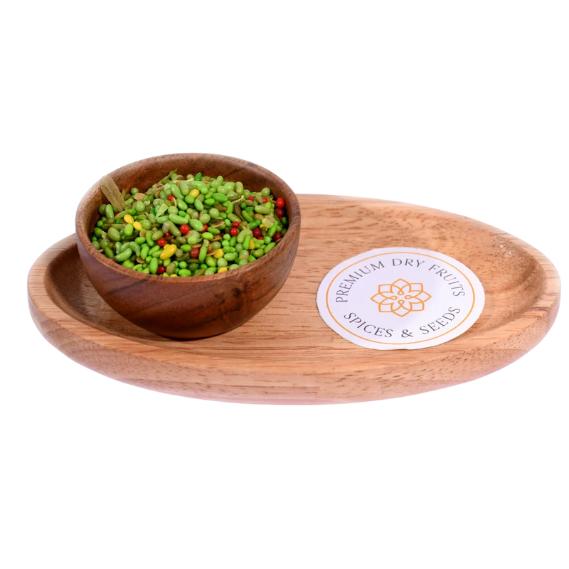 Green Mix Mouth Freshener in a wooden bowl highlights a vibrant mix of fennel seeds and herbs.