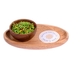 Green Mix Mouth Freshener in a wooden bowl highlights a vibrant mix of fennel seeds and herbs.