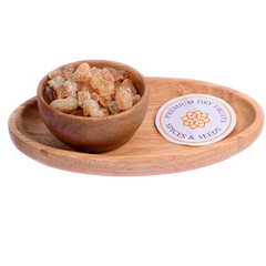 Gum / Gaundh in a wooden bowl showcases natural, crystal-like edible gum pieces.