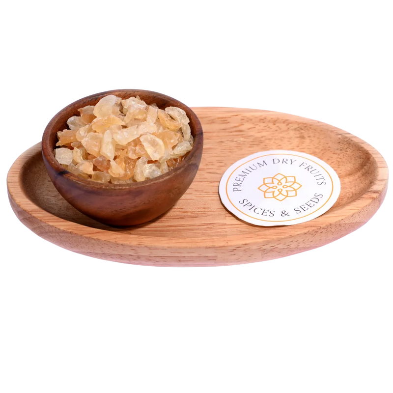 Gum Tragacanth / Gaundh Kateera in a wooden bowl showcases natural, translucent gum crystals.