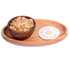Gum Tragacanth / Gaundh Kateera in a wooden bowl showcases natural, translucent gum crystals.