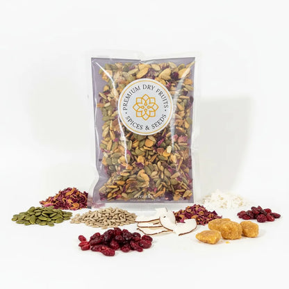 Gur Mewa Mix showing artisanal jaggery blended with coconut flakes, almond slivers, pumpkin seeds, sunflower seeds
