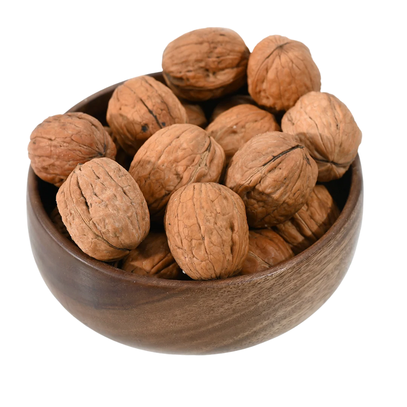 Cracked Chile walnuts showing kernels inside, premium Akhrot nuts for gifting