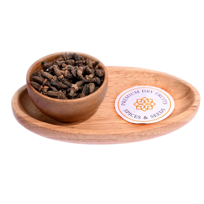 Kapok Buds or Marathi Moggu in a wooden bowl showcase dried, aromatic flower buds.