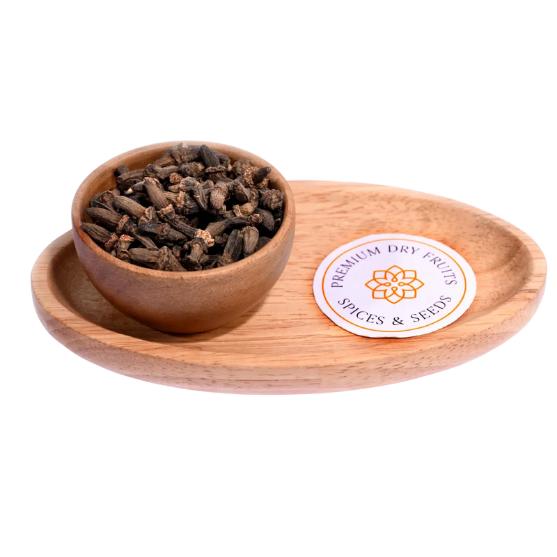 Kapok Buds / Marathi Moggu in a wooden bowl showcase dried, aromatic flower buds.