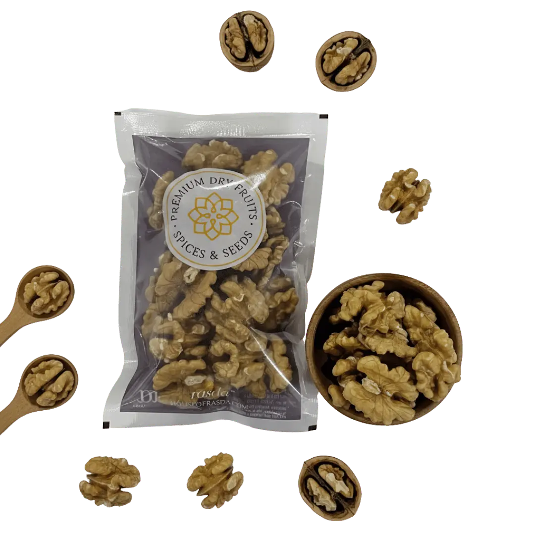 Packaged Kashmiri Walnuts (Akhrot) – Premium Halves with scattered nuts around on a white background