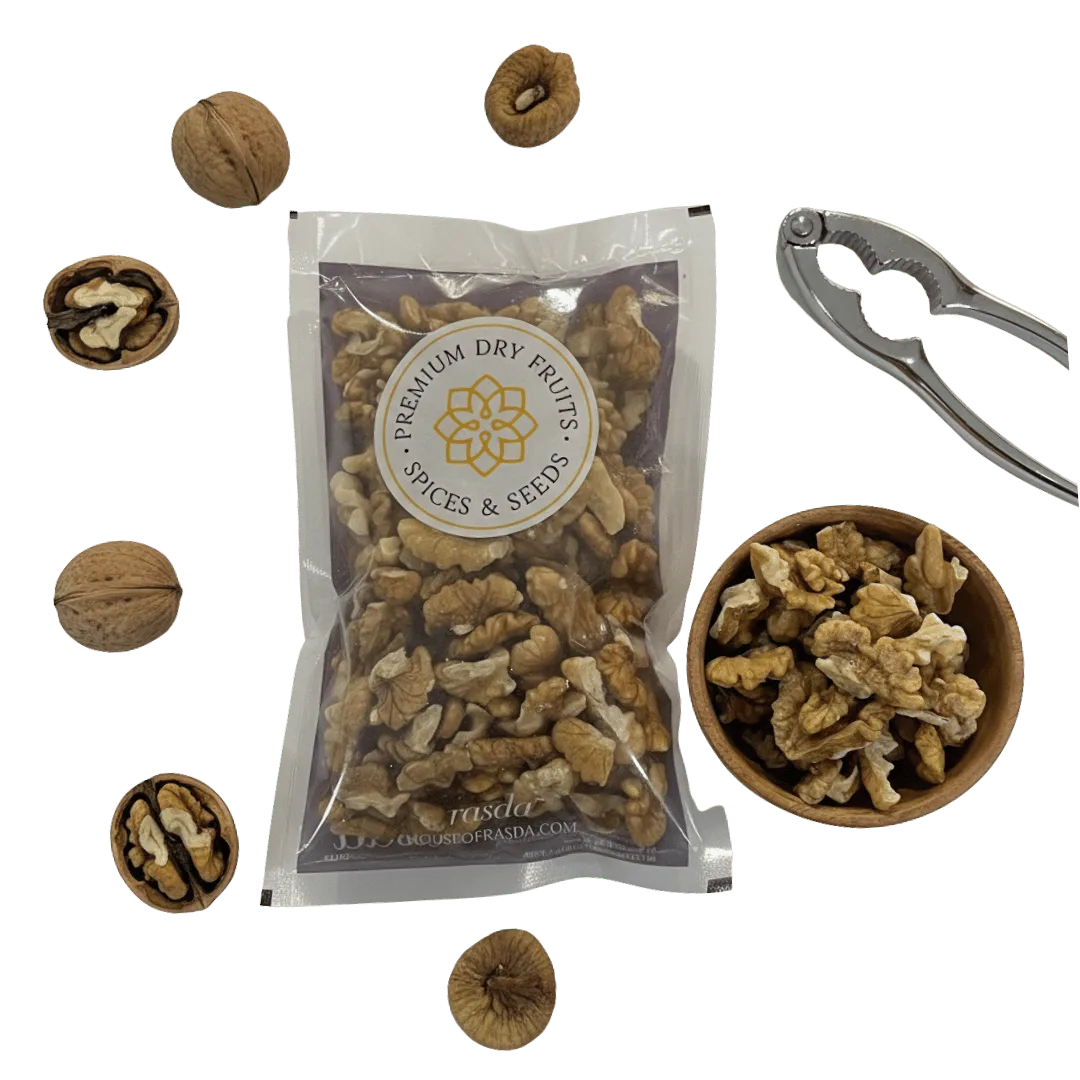 Packaged Kashmiri Walnuts (Akhrot) – Quarters with a bowl of walnuts and a nutcracker on a white background