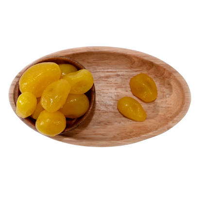 Wooden bowl with yellow candies on a wooden tray - Lemon Dehydrated