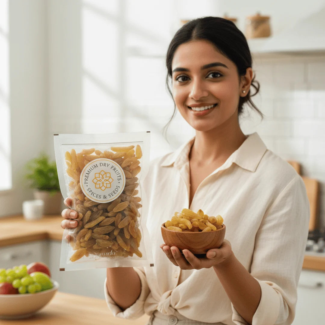 Woman holding a package and a bowl of Long Raisins Premium in a kitchen setting