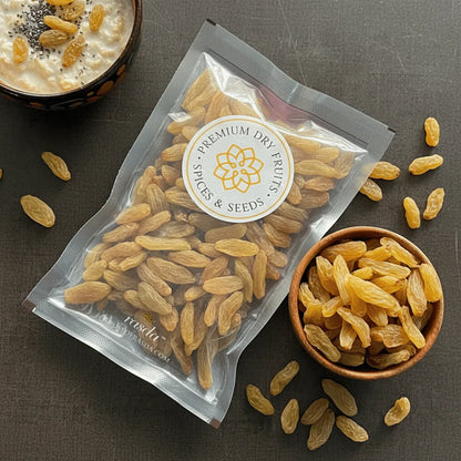 Packaged premium Long Raisins Premium with a bowl of raisins on a dark surface