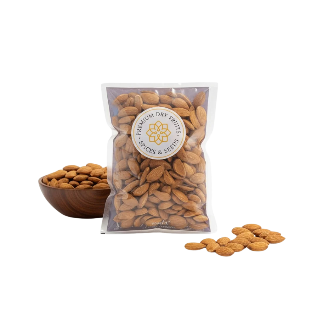 signature mamra almonds 5a grade in a clear bag with a visible Packed brand label, next to a wooden bowl and scattered almonds on a white background.