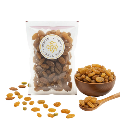 Packaged Munakka Raisins Premium with a bowl and spoon on a white background
