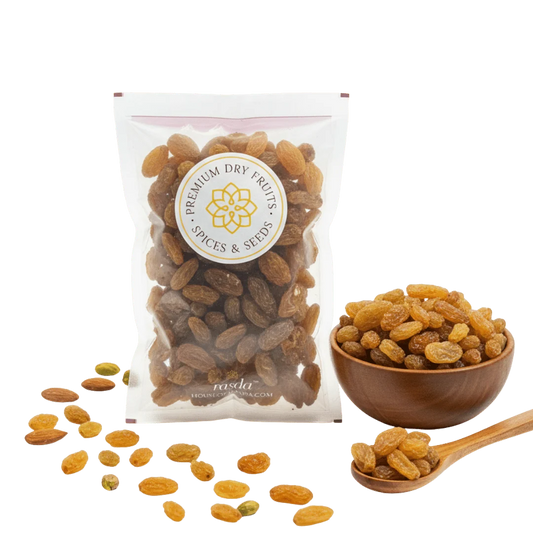 Packaged Munakka Raisins Premium with a bowl and spoon on a white background