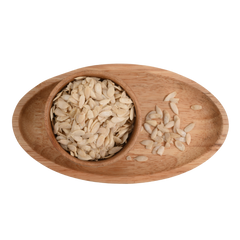 Kharbuja Magaj Premium muskmelon seeds served in a handcrafted wooden bowl for healthy snacking.