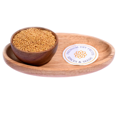 Yellow Mustard Seeds in a wooden bowl showcase fresh, premium-quality seeds for cooking.