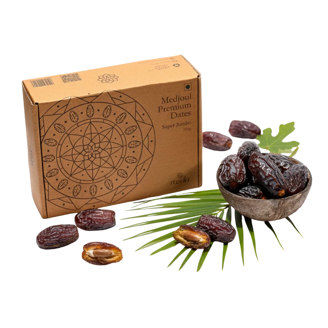 Box of Medjoul Premium Dates with dates and palm leaves on a white background