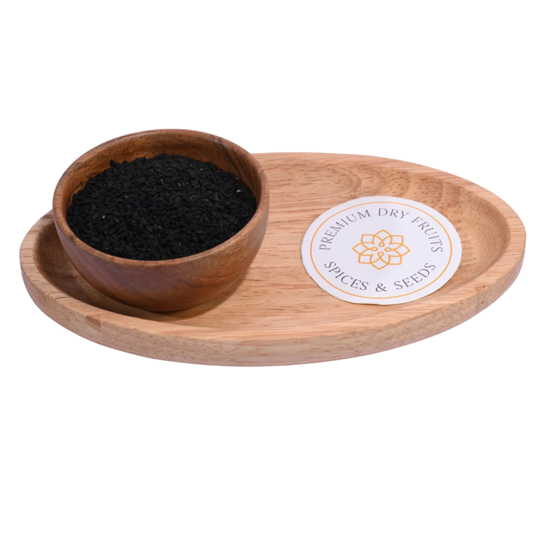Tiny black Nigella Seeds / Kalonji Seeds displayed in a wooden bowl, highlighting their natural texture and aromatic quality.