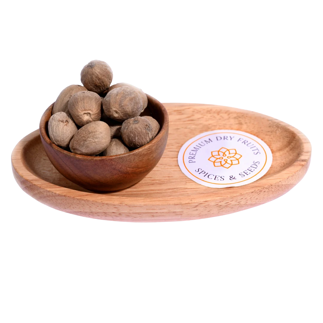 Nutmeg or Jaiphal in a wooden bowl showcases whole, premium-quality spice seeds.