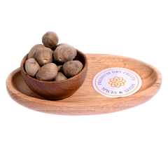 Nutmeg / Jaiphal in a wooden bowl showcases whole, premium-quality spice seeds.