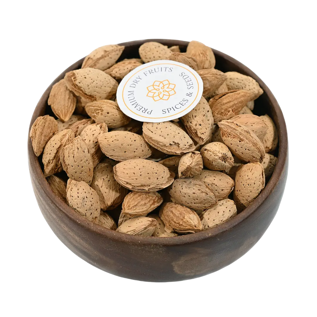 Paper Shell Almonds/ Thin Shelled Almonds/ Kagzi Badam - Wooden bowl filled with almonds on a white background, featuring a brand label.