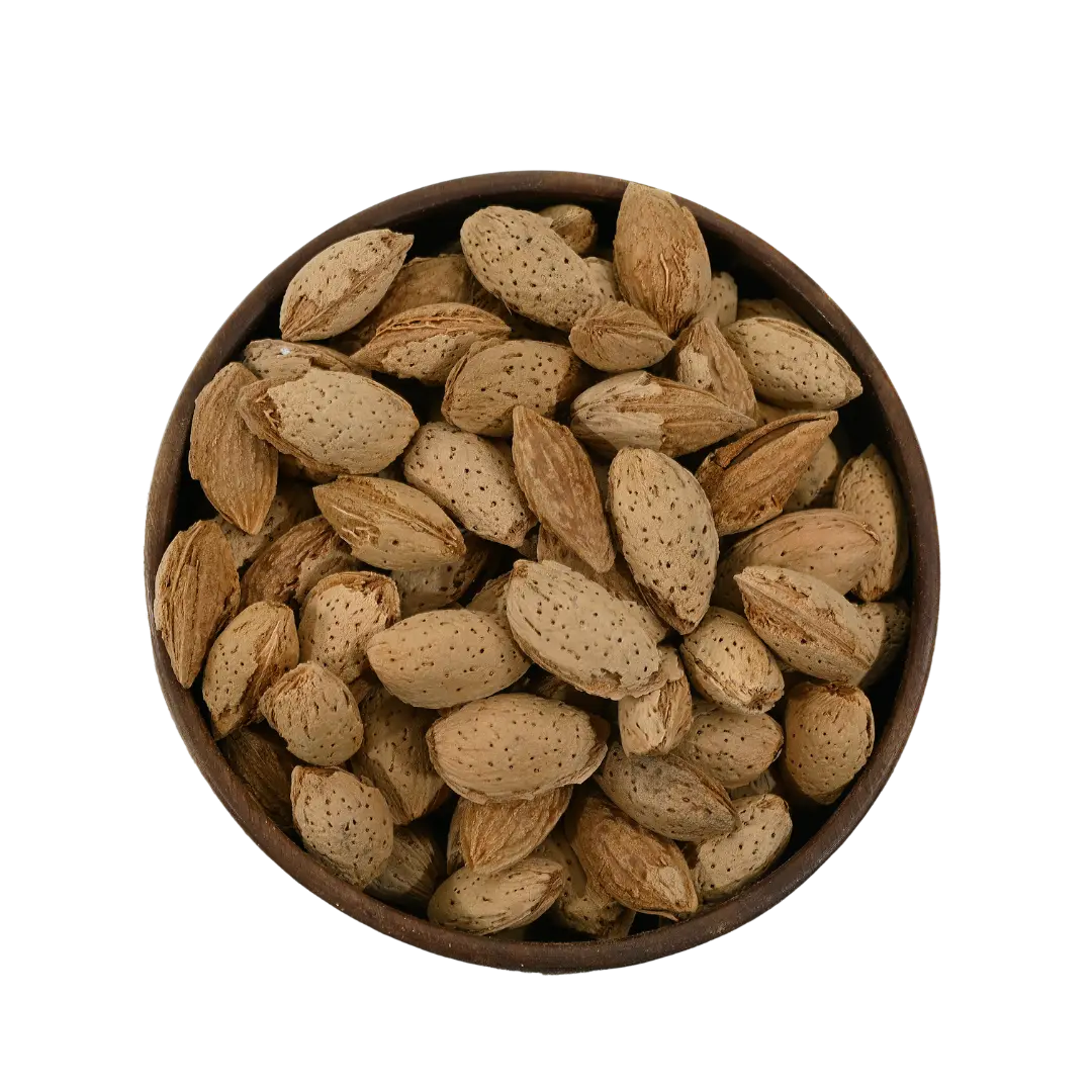 Paper Shell Almonds/ Thin Shelled Almonds/ Kagzi Badam - Wooden bowl filled with almonds on a white background