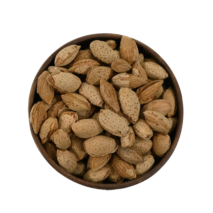 Paper Shell Almonds/ Thin Shelled Almonds/ Kagzi Badam - Wooden bowl filled with almonds on a white background