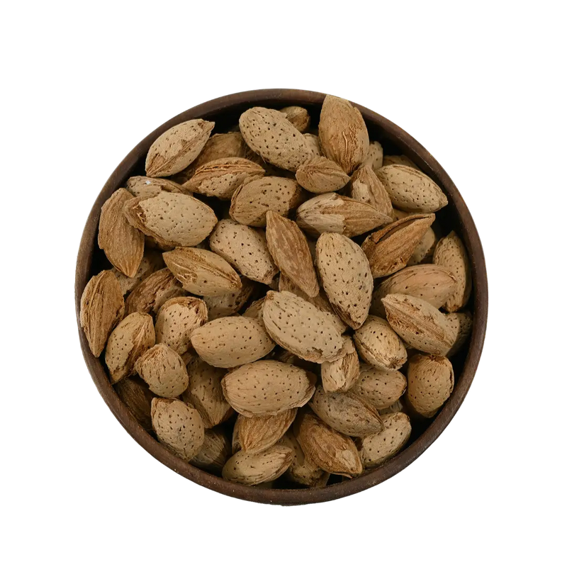 Paper Shell Almonds/ Thin Shelled Almonds/ Kagzi Badam - Wooden bowl filled with almonds on a white background
