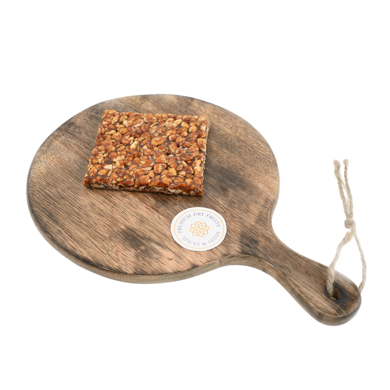 Crunchy peanut chikki made with roasted peanuts and jaggery – a traditional Indian sweet snack, rich in protein and flavor.