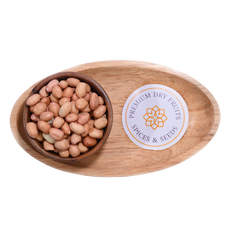 A wooden bowl filled with plain ground nuts or Peanuts plain