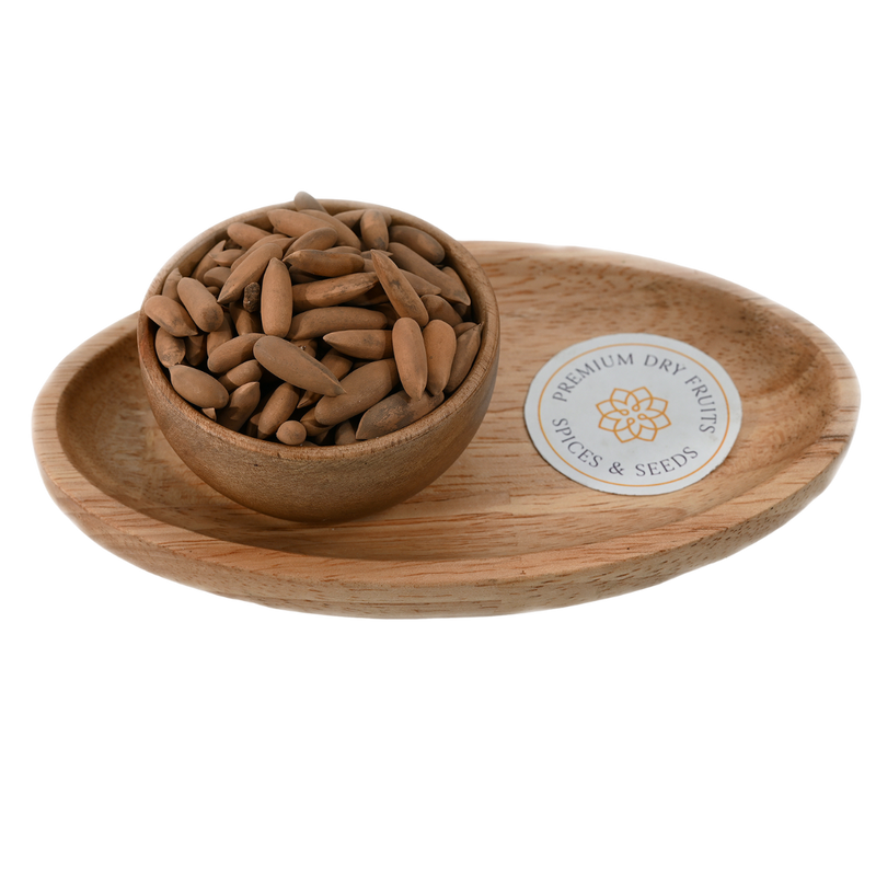 A pile of brown unshelled Exotic pine nuts, Pine nuts with shell, also known as exotic Chilgoza.