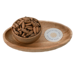 A pile of brown unshelled Exotic pine nuts, Pine nuts with shell, also known as exotic Chilgoza.