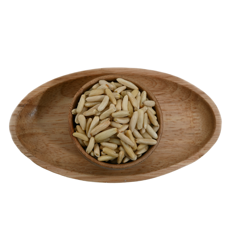 Premium pine nuts without shell in a rustic wooden bowl – nutritious dry fruits rich in healthy fats and protein