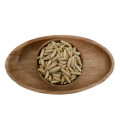 Premium pine nuts without shell in a rustic wooden bowl – nutritious dry fruits rich in healthy fats and protein