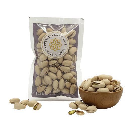 Pistachios (Pista) – In-Shell Roasted & Salted Premium Packed with Rasda Brand and Pistas in a wooden bowl on a white