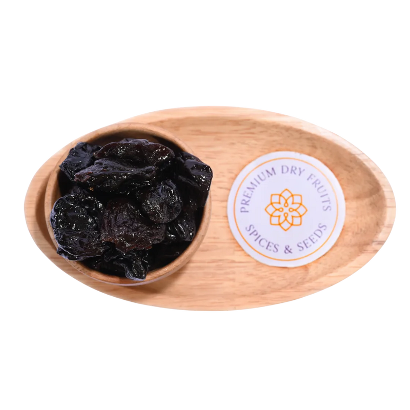 Pitted Prunes Dried close-up view highlighting their rich hue and soft, pitted texture.