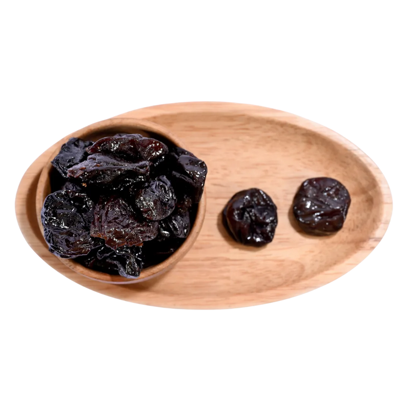 Pitted Prunes Dried arranged neatly showing their plump shape and dark, shiny appearance.