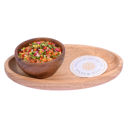 Poona Mix Mouth Freshener in a wooden bowl showcases a colorful blend of seeds and spices.