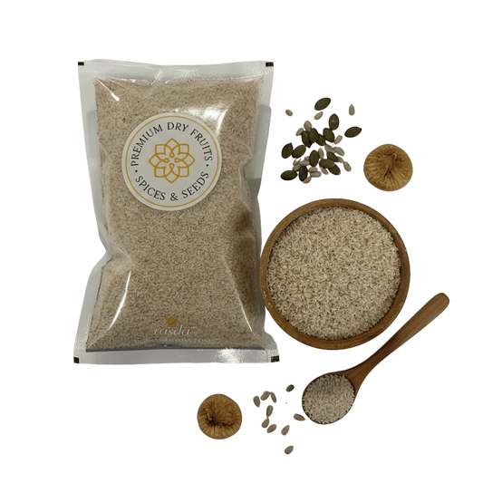 Psyllium Husk packaging with a bowl, spoon, and scattered seeds on a white background