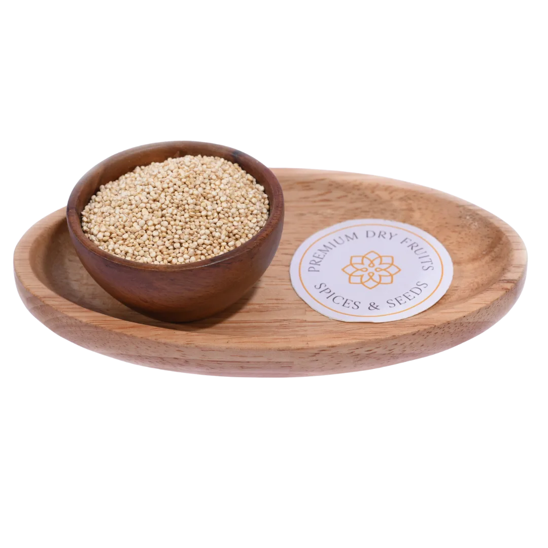 Small, round Quinoa White Seeds in a wooden bowl, showcasing their pale cream color and natural texture.