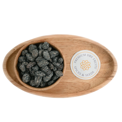 Premium Black Khatta Meetha Raisins or Kismis in Wooden Bowl – Delicious Sweet and Sour Snack Packed with Nutrition