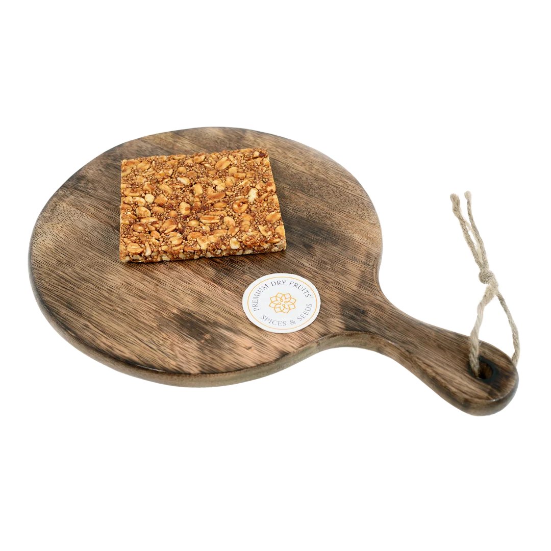 Rajgira Peanut Chikki on wooden plate traditional Indian sweet made with jaggery roasted peanuts and amaranth healthy