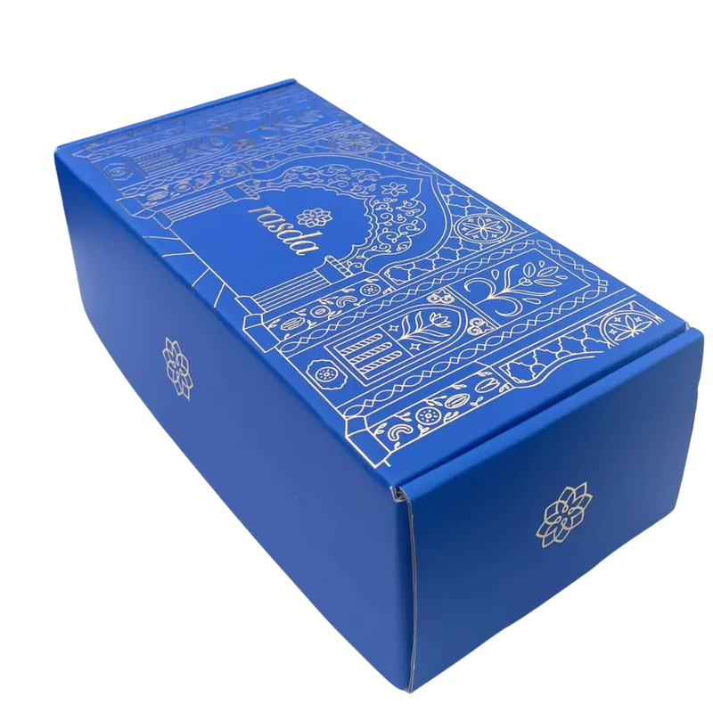 Blue decorative box with intricate white patterns on a white background