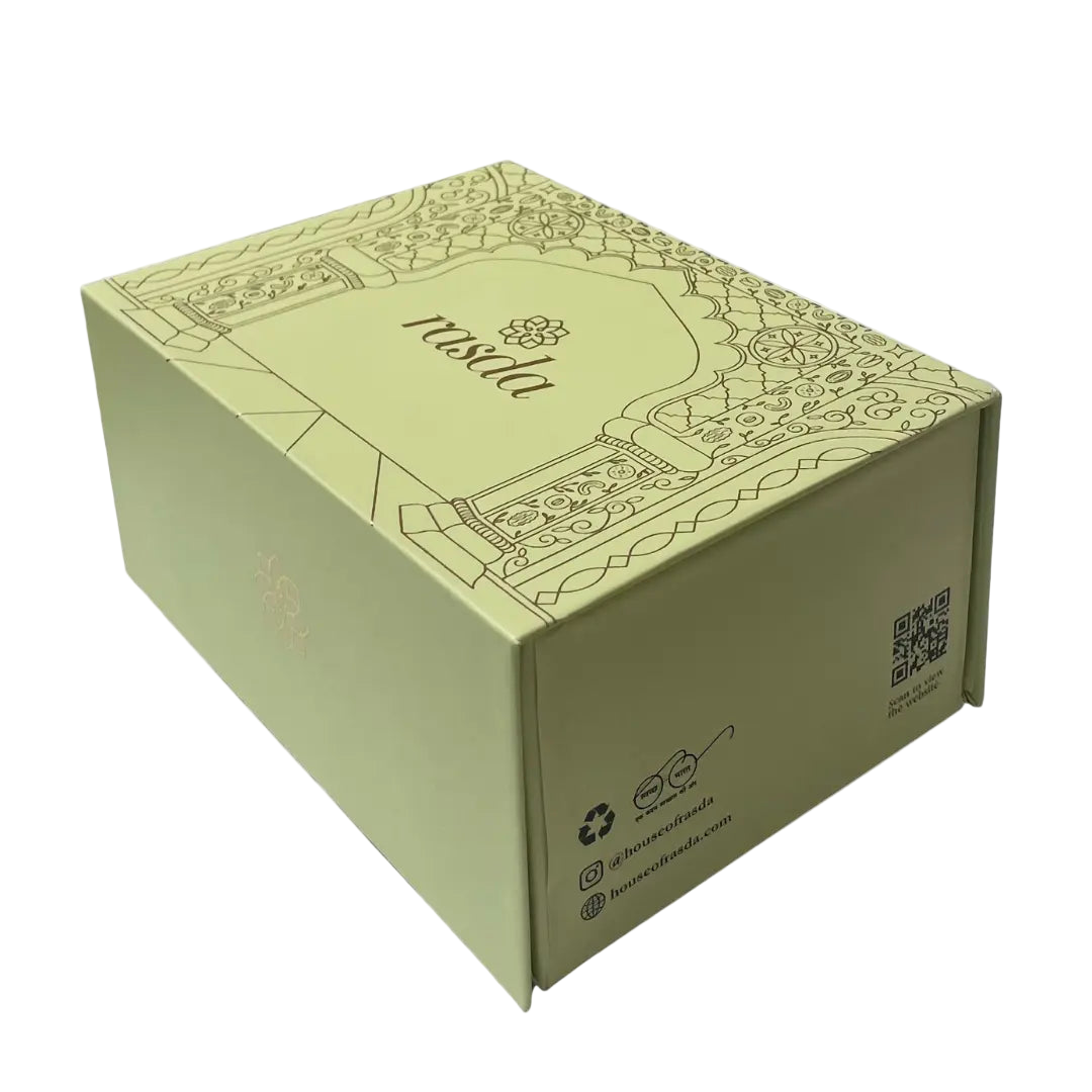 Green box with decorative design on a white background - Rasika Dry fruits Gift Box with Tins.