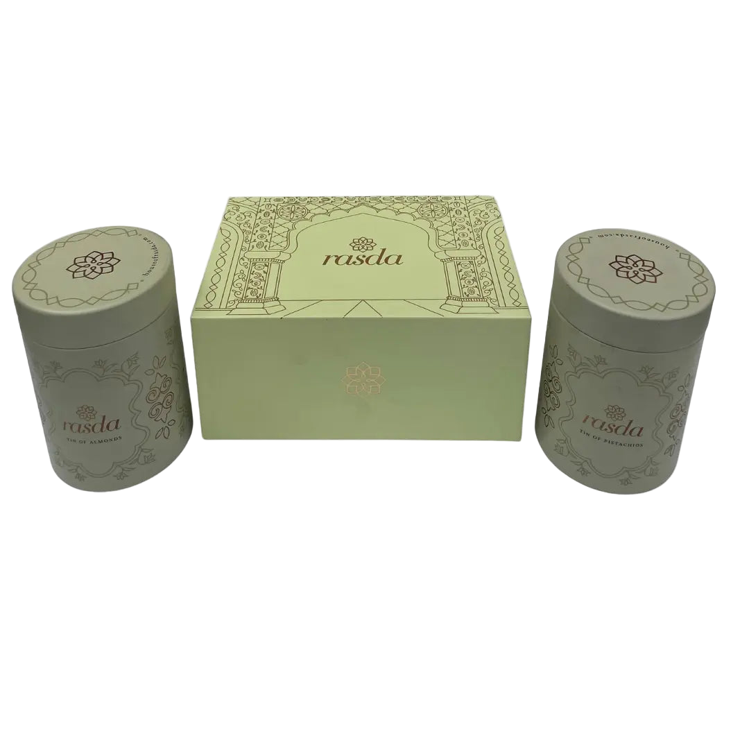 Two cylindrical green containers with a matching box featuring Rasika Dry fruits Gift Box with Tins Rasda branding on a white background.