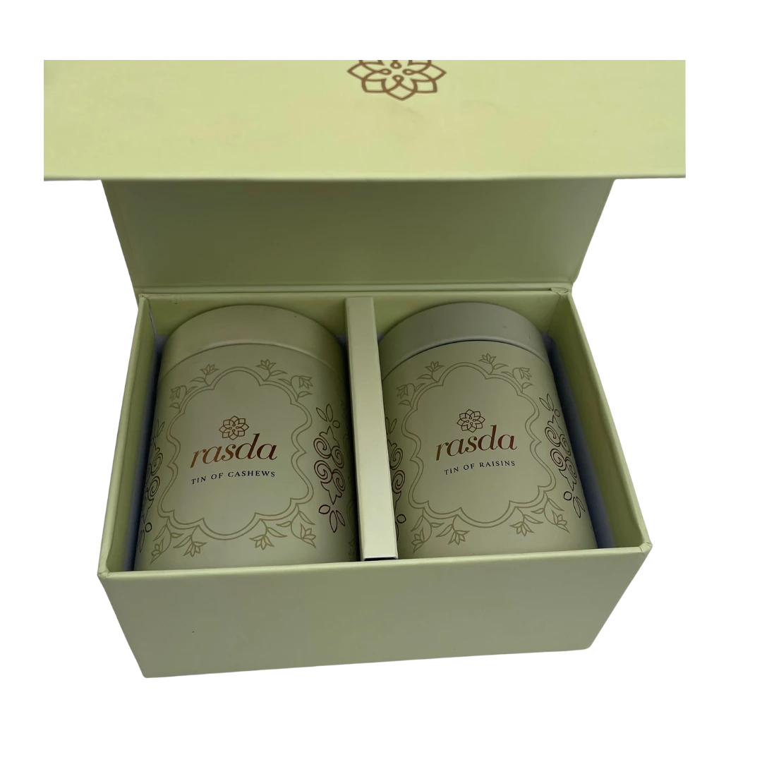 Two cans of 'rasda' in a green box on a white background - Rasika Dry fruits Gift Box with Tins