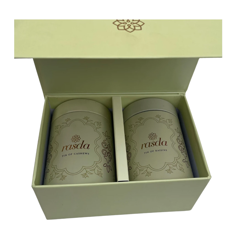 Two cans of 'rasda' in a green box on a white background - Rasika Dry fruits Gift Box with Tins