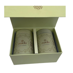 Two cans of 'rasda' in a green box on a white background - Rasika Dry fruits Gift Box with Tins