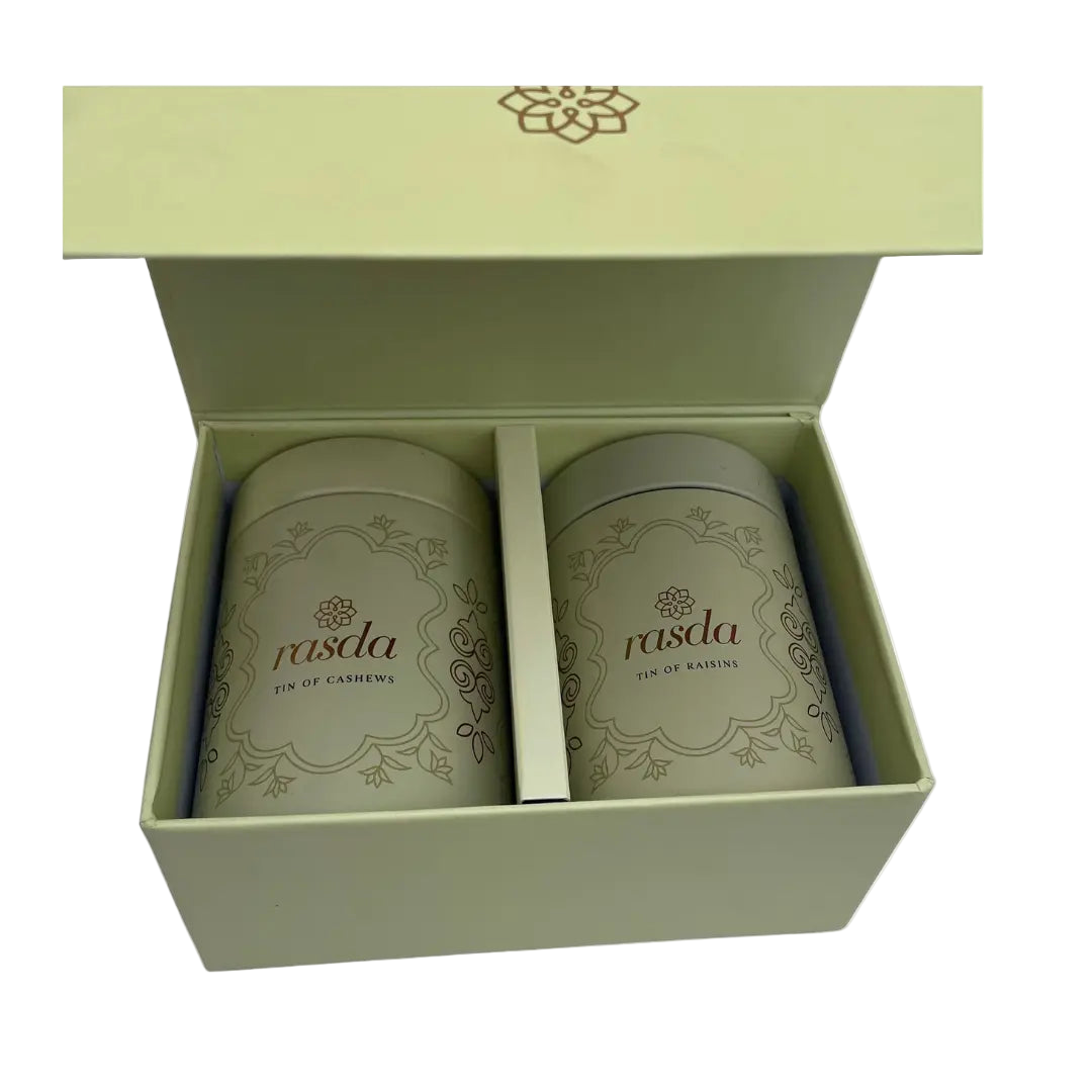 Two cylindrical containers Rasika Dry fruits Gift Box with Tins  rasda branding in a green box on a white background