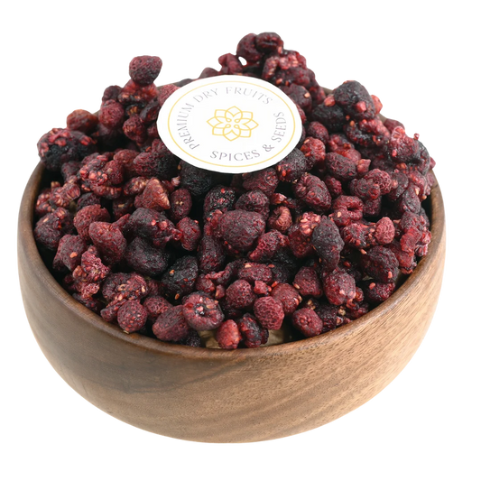Premium raspberries dried in a wooden bowl, showcasing their deep red color and natural texture.